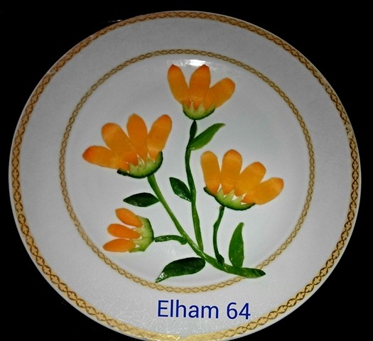 عکس دیزاین با سبزیجات (خیار و هویج). نمادی از گل همیشه بهار