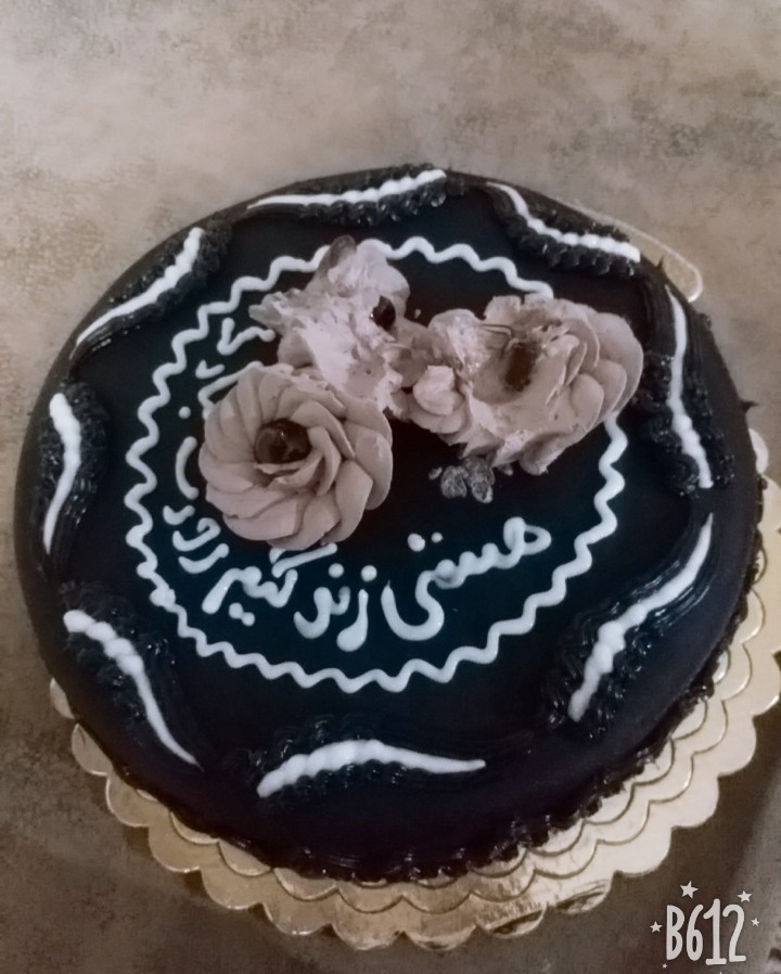 عکس کیک خامه ای بارویه ی شکلات