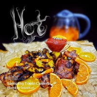 ران مرغ پرتقالی کبابی طعم دار شده با کره و زعفران