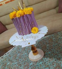 کیک دخترونه با طرح اوریگامی با تزئین کاسه ایزومالتی وگلهای طبیعی